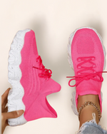 Top view of OrthoEase Luxe Bubble sneakers in neon pink with white speckled sole