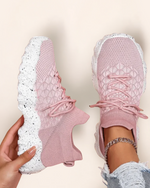 Top view of OrthoEase Luxe Blush sneakers in soft pink with white speckled sole