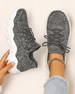 Top view of OrthoEase Luxe Marble sneakers in grey knit with white and black speckled sole