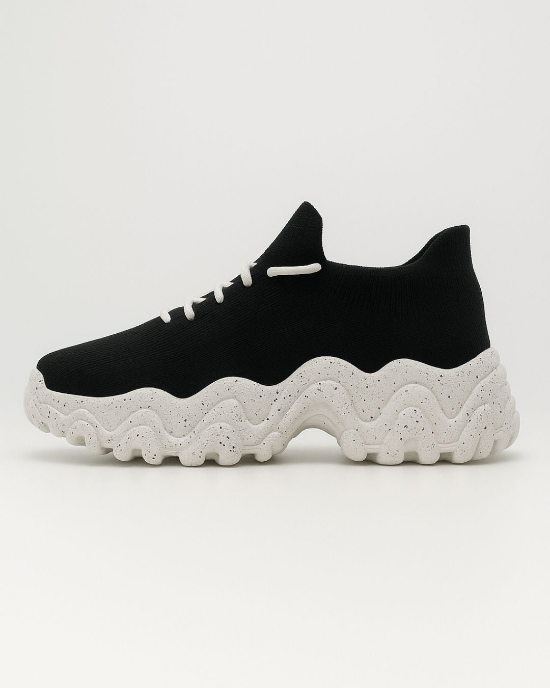 Left side of OrthoEase Luxe Oreo sneaker with white sole