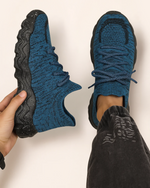 Top view of OrthoEase Luxe Cobalt sneakers showing textured knit and black speckled sole