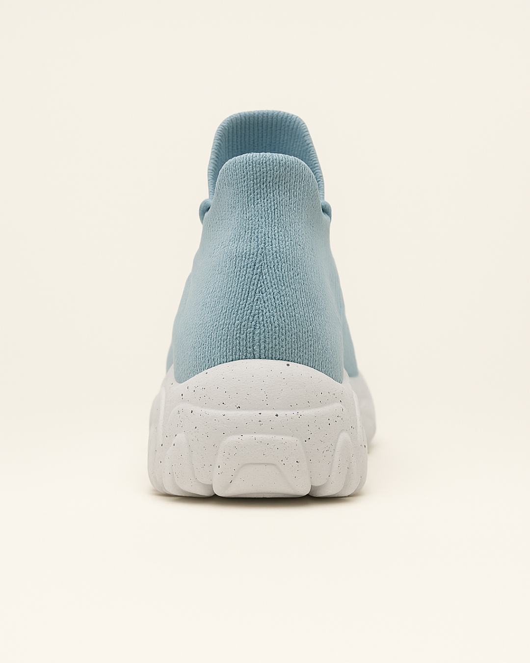 Back heel of OrthoEase Luxe Glacier sneaker showing ankle height