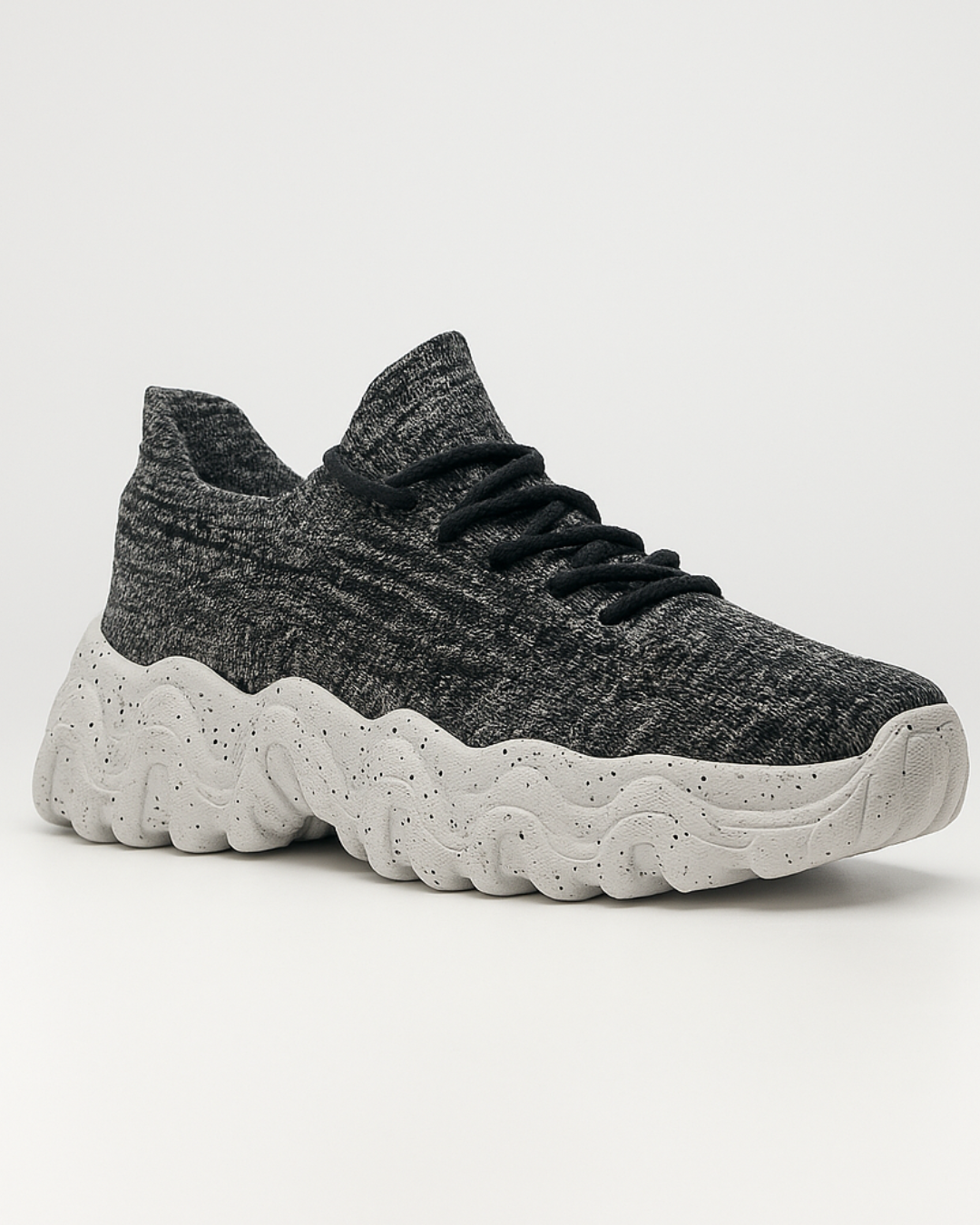 Angled view of OrthoEase Luxe Marble sneaker showing knit design