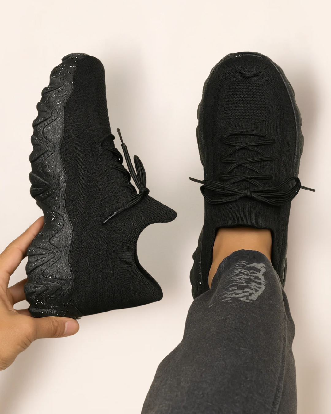 Top view of OrthoEase Luxe Midnight all-black sneakers with speckled sole