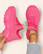 Top view of OrthoEase Luxe Pop Pink sneakers with bold pink knit and matching sole