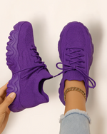 Top view of OrthoEase Luxe Royal sneakers in vibrant purple with matching sole